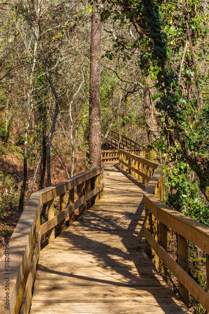 The river hiking trail Ecovia do Vez near Arcos de Valdevez, Portugal. Ecovia do Vez wooden pathways along the riverside. The river hiking trail Ecovia do Vez near Arcos de Valdevez, Portugal. Ecovia do Vez wooden pathways along the riverside.