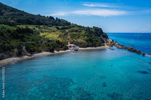 Aerial view of beach with Chapel of St Nikola near Skala and Paramonas villages, Corfu Island, Greece