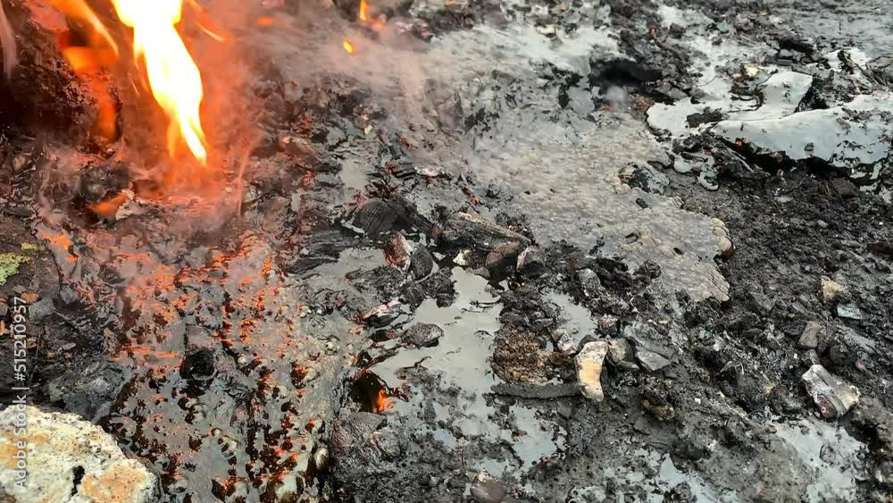 Boiling lava on fire. Pollution of ecology and environment. The hot dangerous liquid bubbles up releasing hazardous chemicals into the air. Boiling lava on fire. Pollution of ecology and environment. The hot dangerous liquid bubbles up releasing hazardous chemicals into the air.