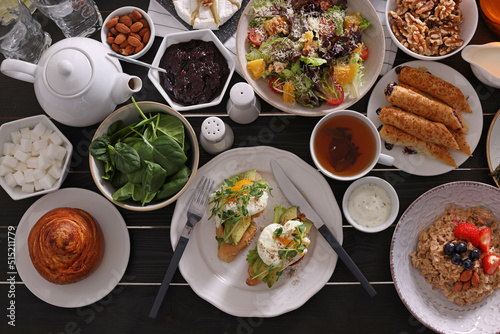 Many different dishes served on buffet table for brunch, flat lay