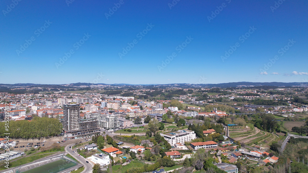 Santo Tirso, Portugal - April 3, 2022: DRONE AERIAL VIEW - Apartment buildings, 25th of April Square (Portuguese: Praca 25 de Abril) and Santo Tirso City Hall.