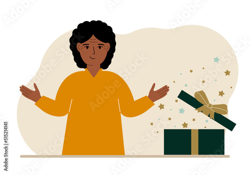 A woman next to an open gift. The concept of a holiday, surprise, promotion, discount.