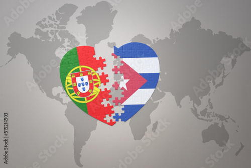 puzzle heart with the national flag of portugal and cuba on a world map background.Concept.