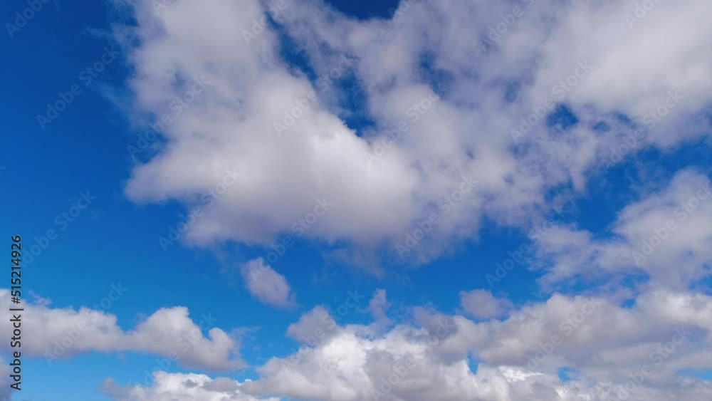 Timelapse: Abstract cumulus clouds cross natural empty blue sky Timelapse: Abstract cumulus clouds cross natural empty blue sky