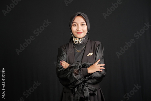 Portrait of Indonesian woman wearing hijab folding her hands