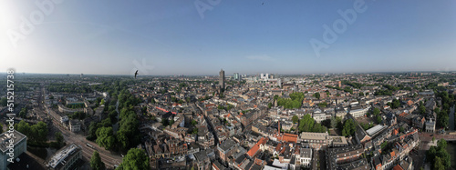 Wide aerial skyline panorama of the medieval Dutch city centre of Utrecht with cathedral towering over the city at daytime sunrise. Cityscape in The Netherlands flat landscape