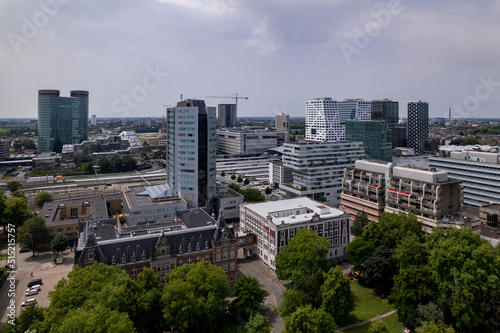 Aerial view of financial district and central train station area with modern architecture and historic office buildings in city center of Dutch urban Utrecht in The Netherlands