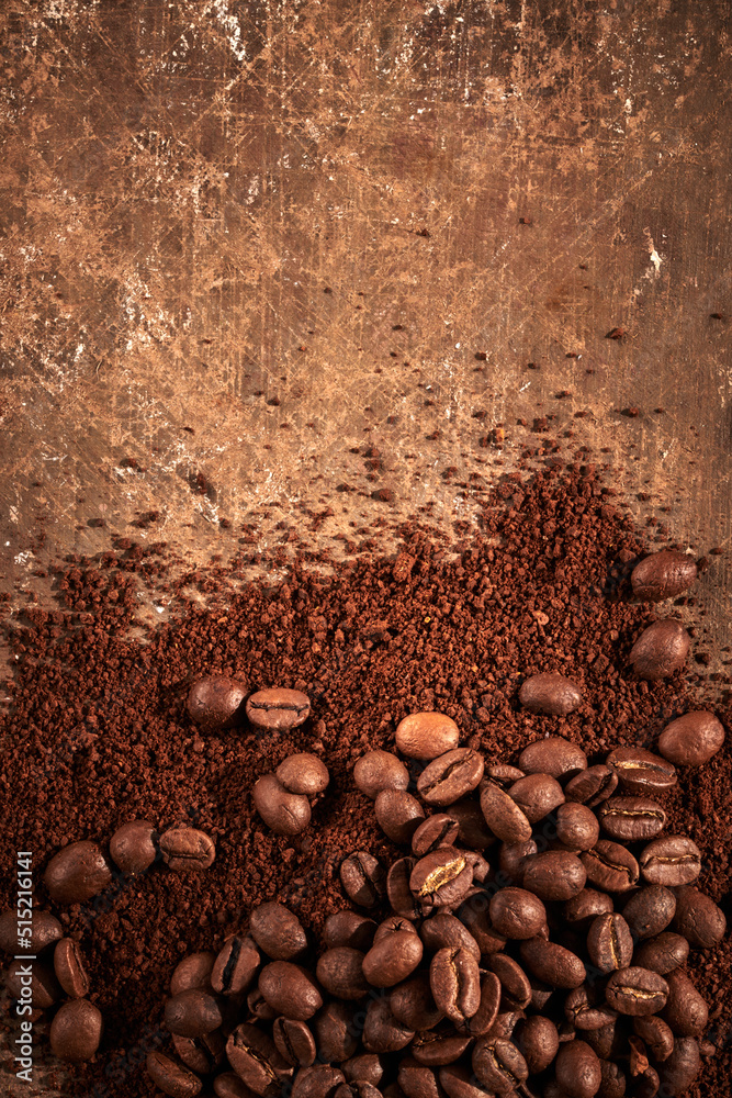 Roasted coffee beans different sort ground and whole isolated close up on brown grunge background Roasted coffee beans different sort ground and whole isolated close up on brown grunge background