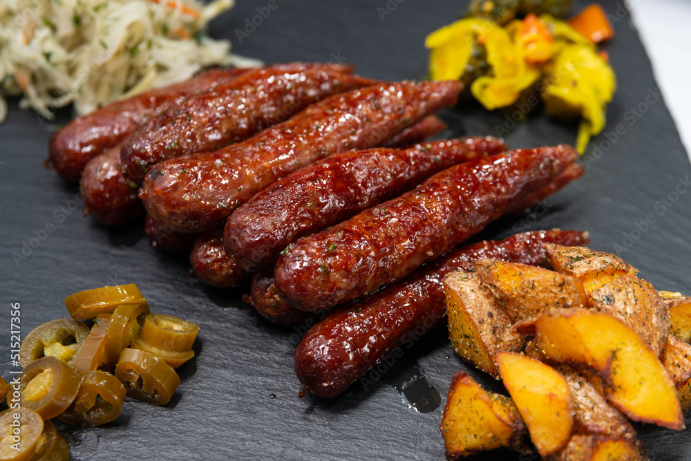 grilled sausages with vegetables close up 