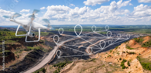 Innovation aerial uav drone copter flying with camera above opencast mining open coal. Concept engineering geology industry photo