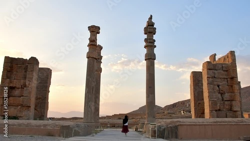 Persepolis, Iran - 8th june, 2022: tourist walk by giant column statues - Gates of all nations. Entrance to remains of historical persian city in Persia