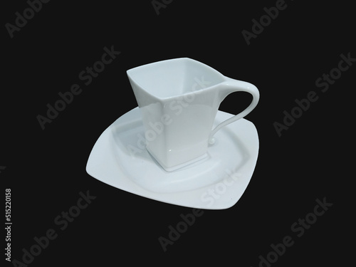 A set of specially shaped cups and plates combined isolated on a black background