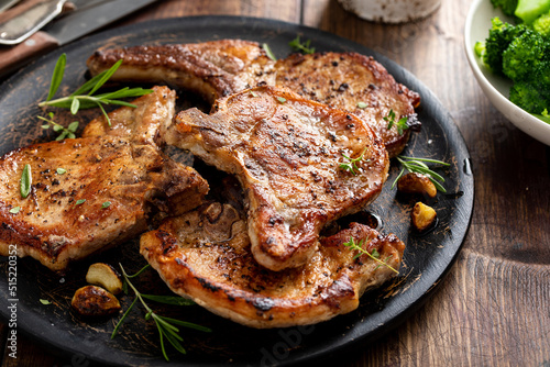 Grilled or pan fried pork chops on the bone photo
