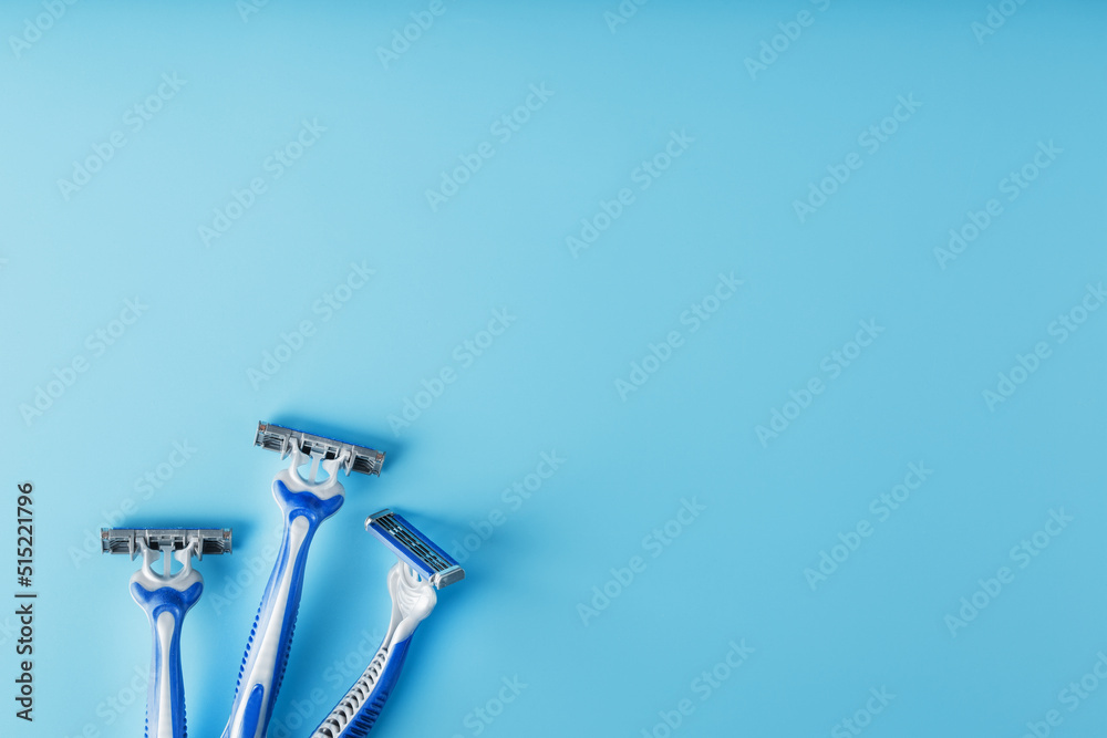Blue shaving machines in a row on a blue background