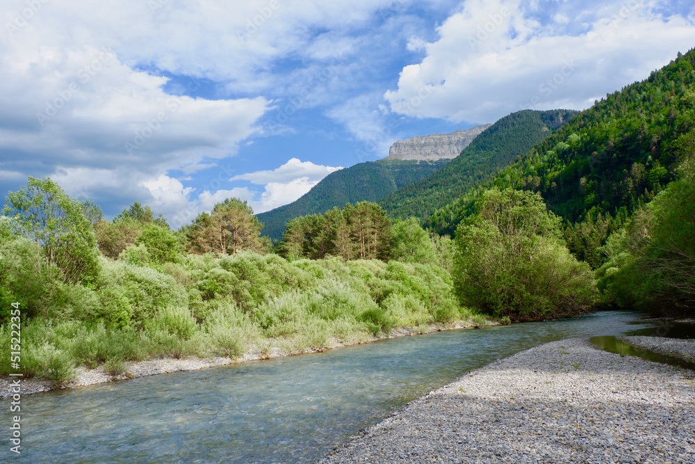 Peaceful mountain landscape with river during summertime on the Spanish side of Pyrenees mountain range, Spain