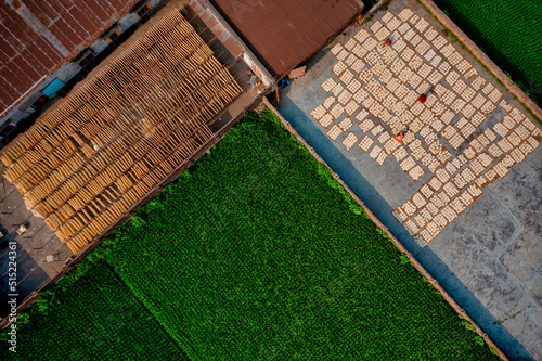 Aerial view of Women at work on the preparation of natural fabric, Barga, Rajshahi, Bangladesh. photo