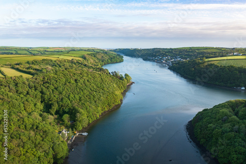 Aerial view looking down the river Lerryn above the treetops at sunset, Lostwithiel, Lerryn, Cornwall, United Kingdom. photo