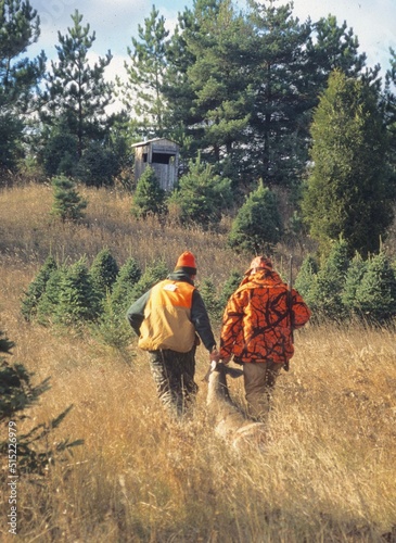Slika na platnu A pair of hunters dragging a buck