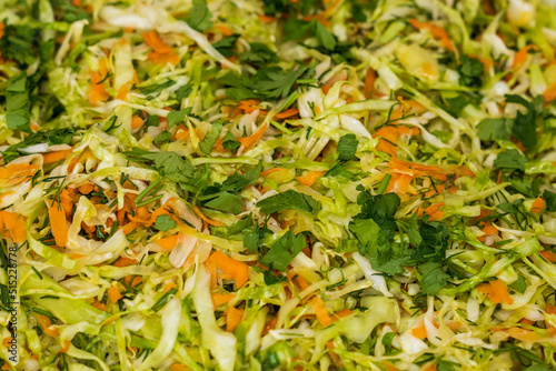 Close up of coleslaw and greens for sale at the international street food festival photo