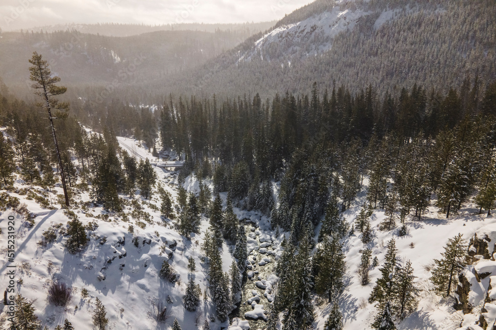 Aerial view of a valley landscape in winter at sunset, Tumalo Falls, Oregon, United States. Aerial view of a valley landscape in winter at sunset, Tumalo Falls, Oregon, United States.