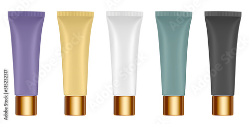 Set of multicolored tubes. 3d mockup. Shades of natural beige color. Concealer or foundation. Salve or ointment. Gold cap. Purple, green, yellow, white and black