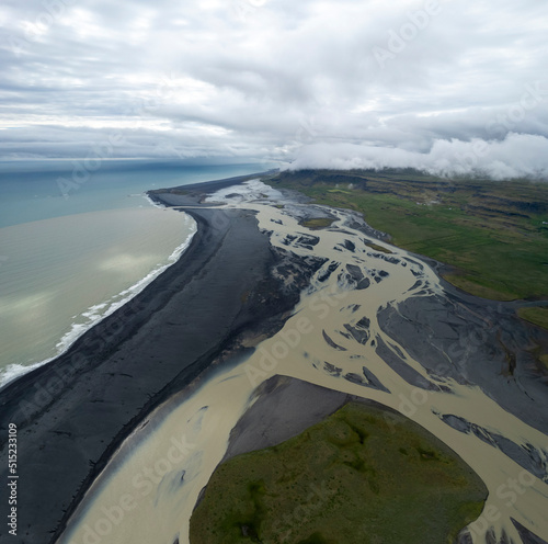 Aerial view of water formation at river estuary near Fjorur beach, Iceland. photo