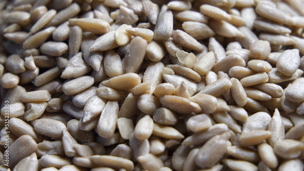 Lots of peeled sunflower seeds close-up, full frame.
