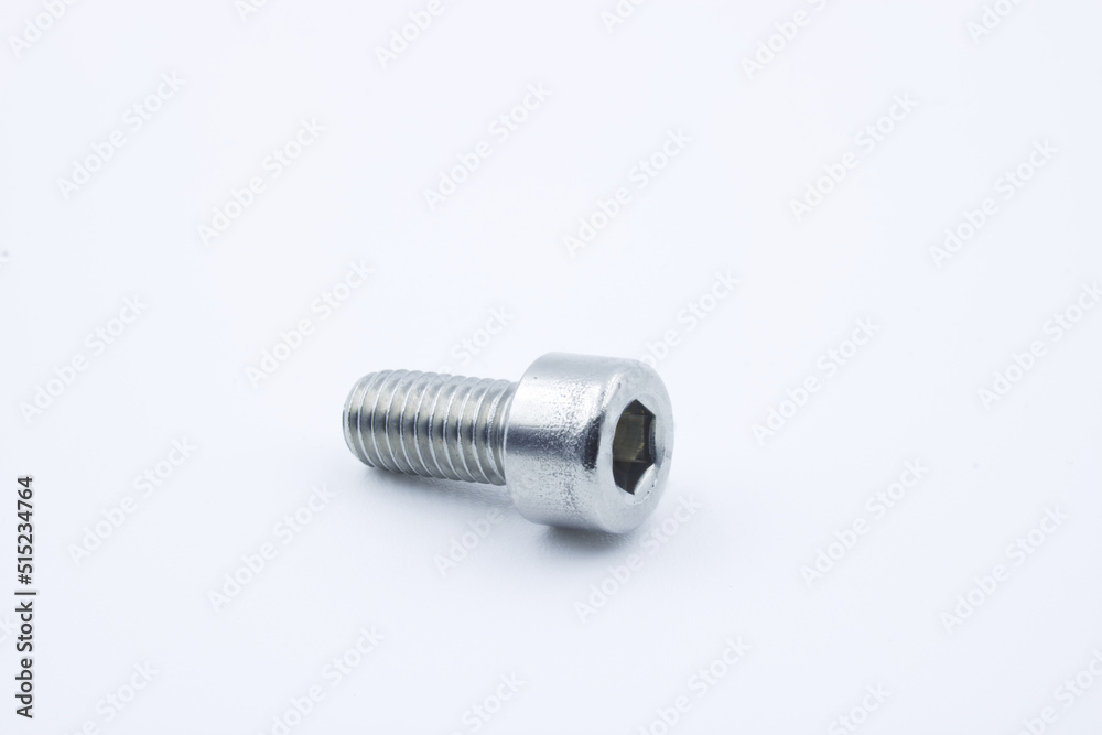 Stainless hex socket socket head cap screw on a white background Stainless hex socket socket head cap screw on a white background
