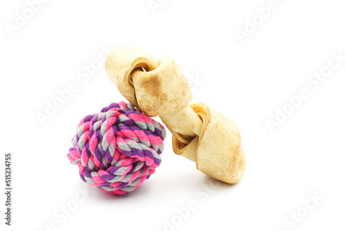 Dog toys, bait and ball of string to chew on, on a white background photo