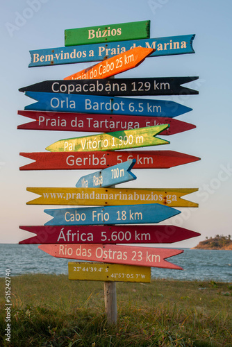 Nice and colorful sign of destinations and distances by the beach in Brazil.  © Alberto