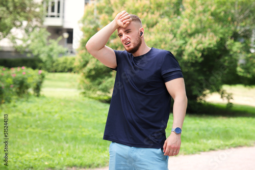 Bilde på lerret young man runner jogging, running suffering from pain, heat, guy with heatstroke