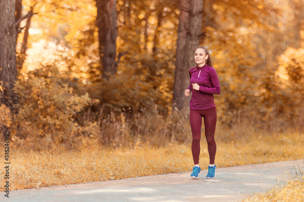 Beautiful smiling girl runs through the morning forest. Beautiful smiling girl runs through the morning forest.