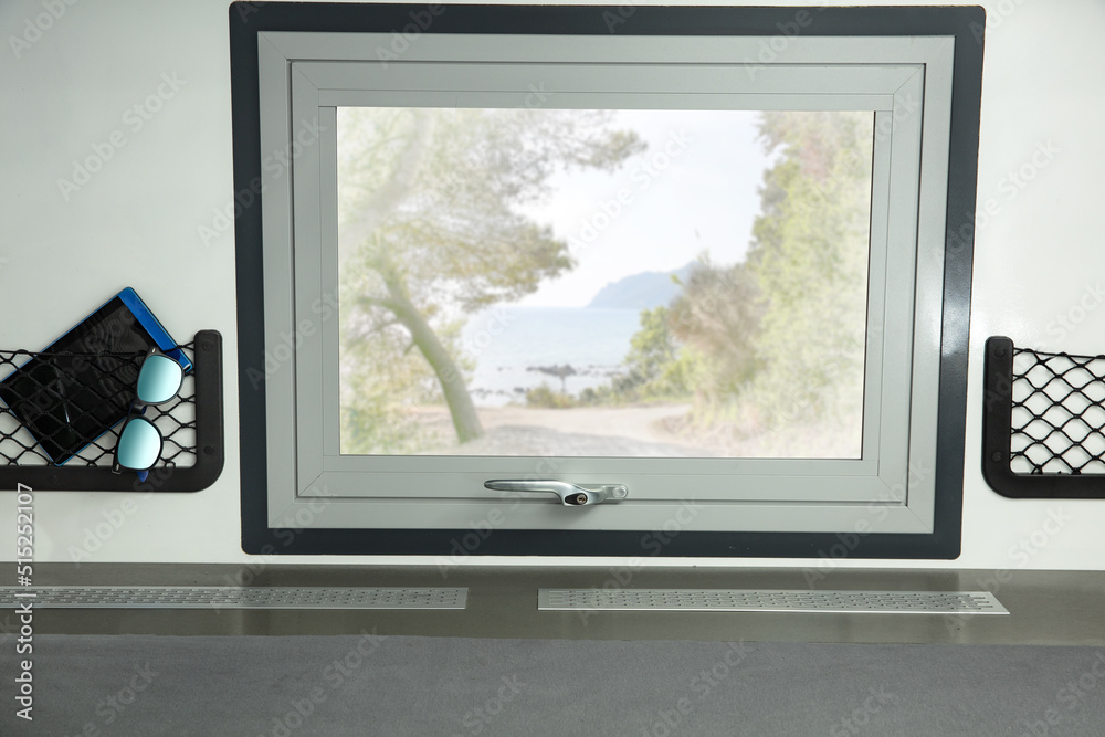 Fototapeta premium Camper window and summer trip time. Free space for your decoration. 