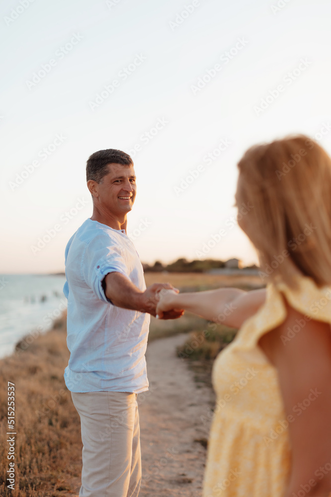 Happy romantic middle aged couple are by the sea. Closeup photo. Happy romantic middle aged couple are by the sea. Closeup photo.