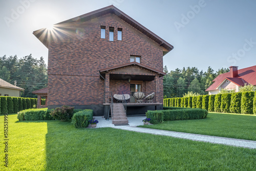 two-story concrete or brick country house