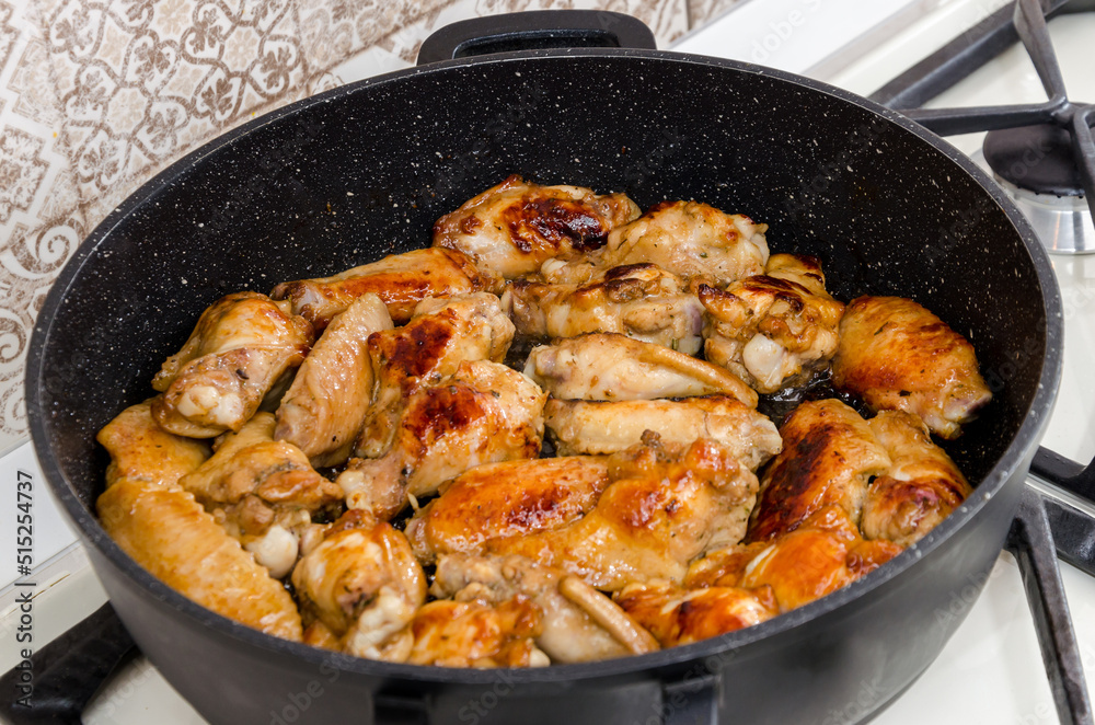 Roasted chicken legs in pan Roasted chicken legs in pan
