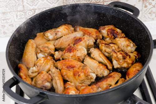 Roasted chicken legs in pan