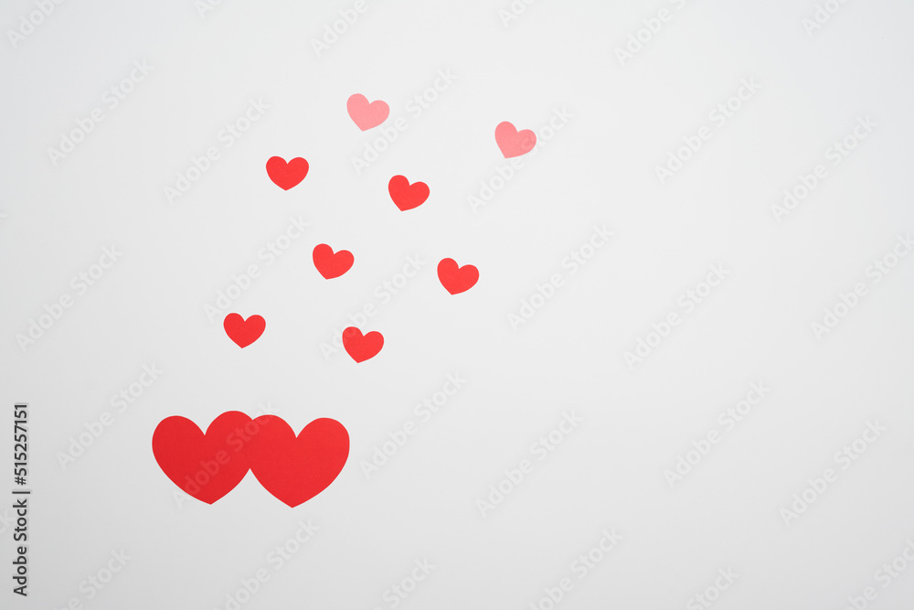 Red paper Valentines Day heart against a white background