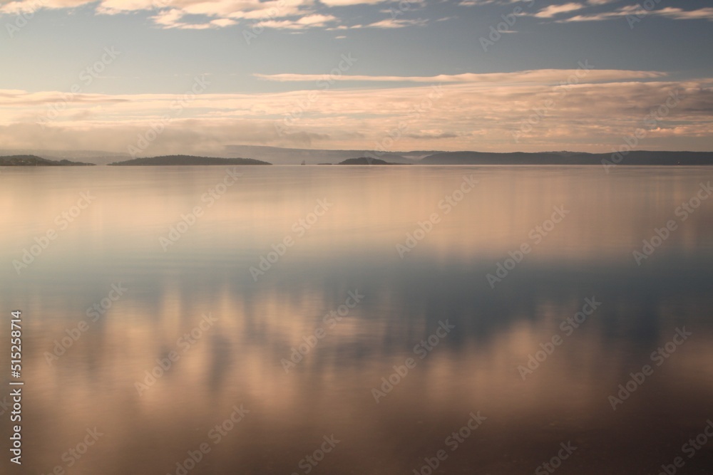 reflection of clouds in calm water - Lysaker