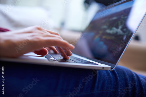 Beautiful woman relaxing at home with notebook