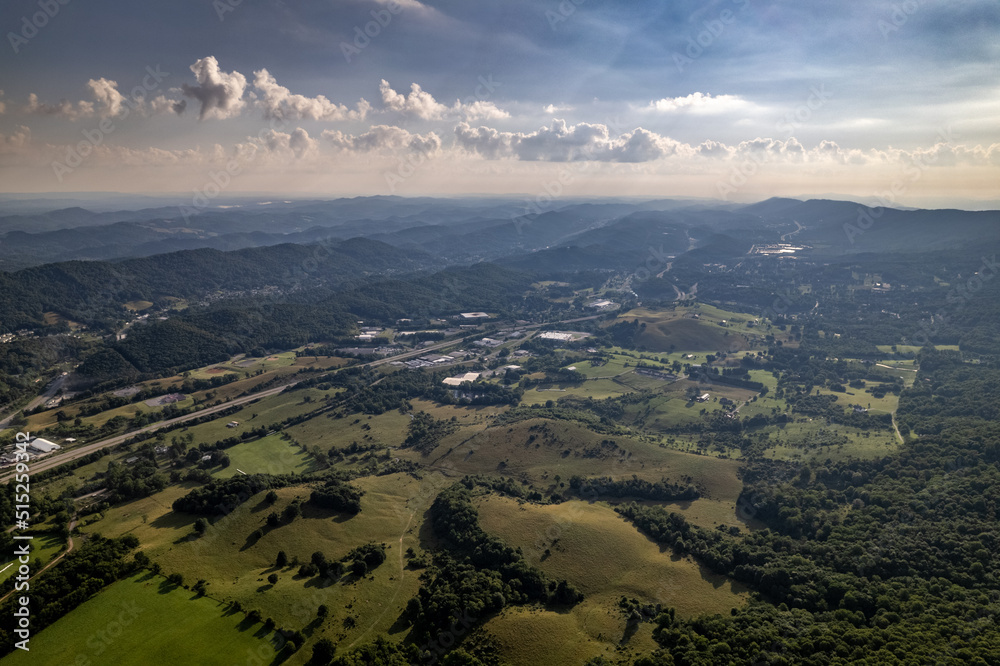 Above Farmland Leading to Green Mountains