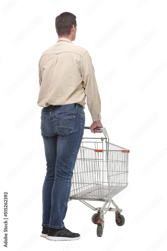 Back view of person pushing a shopping cart in car park