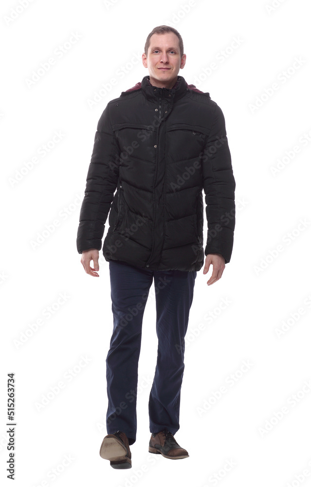 casual young man in autumn jacket striding forward. casual young man in autumn jacket striding forward.