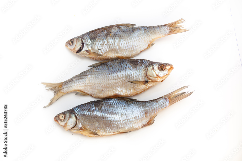 Dry fish. Seafood snack for beer. Salted sun-dried, jerked or smoked fish. Taranka, vobla. Russian or Ukrainian food. Caspian roach fish. Dead fish. High resolution photo. On white background