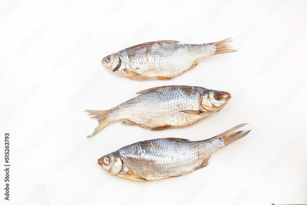 Dry fish. Seafood snack for beer. Salted sun-dried, jerked or smoked fish. Taranka, vobla. Russian or Ukrainian food. Caspian roach fish. Dead fish. High resolution photo. On white background Dry fish. Seafood snack for beer. Salted sun-dried, jerked or smoked fish. Taranka, vobla. Russian or Ukrainian food. Caspian roach fish. Dead fish. High resolution photo. On white background