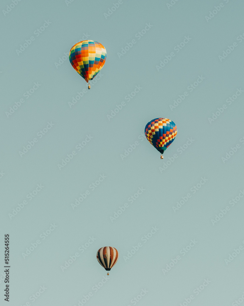 Fototapeta premium Hot air balloons flying in the blue sky