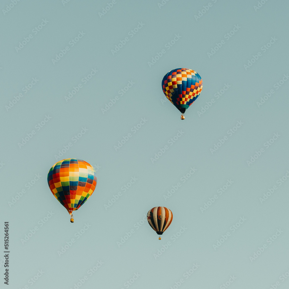 Fototapeta premium Hot air balloons flying in the blue sky