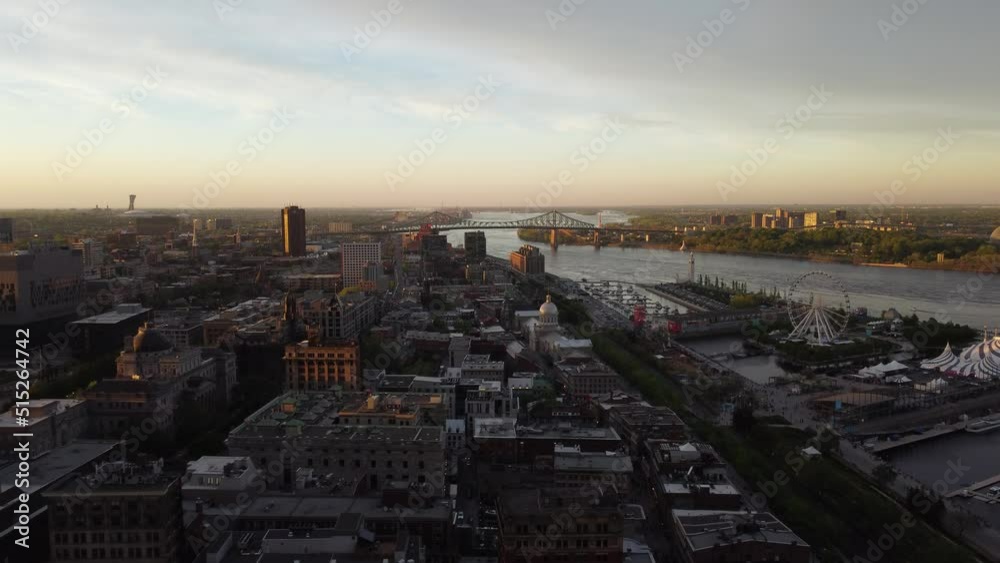 Downtown sunset with bridge in background. (4k drone footage) Downtown sunset with bridge in background. (4k drone footage)