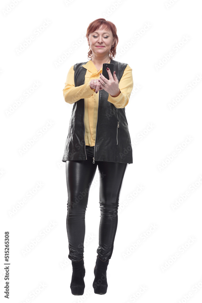 in full growth. happy mature woman with smartphone. in full growth. happy mature woman with smartphone.