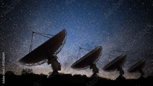 Many radar telescopes at night observing signal from stars.